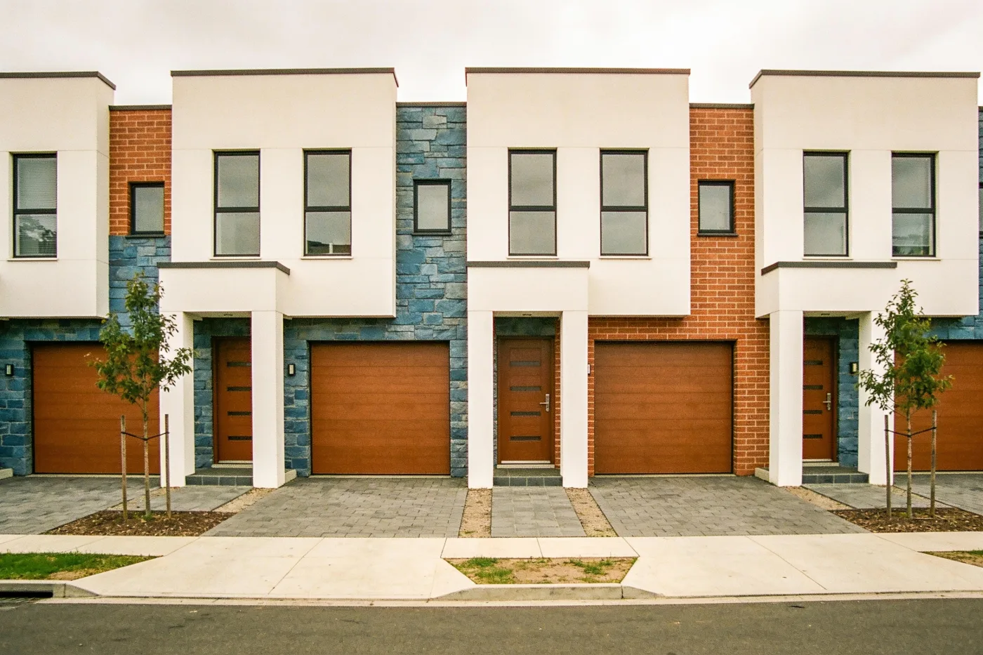 A row of near-identical contemporary townhouses in suburban Melbourne